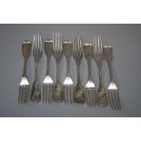 A part set of nine white metal fiddle and thread dessert forks, each monogrammed LSB. 11 troy oz.