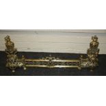 An heavy gilt and pierced brass chenet with urn surmounts  39cm high