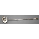A Geo II silver toddy ladle with  ovate shaped bowl and heavy white metal handle. London 1737