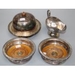 A pair of Victorian silver plated circular wine coasters  with hardwood bases. Together with a