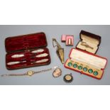 A cased set of early 20th Century silver and green enamel buttons, a 9ct gold bar brooch, a lady's