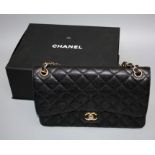 A Chanel-style Jumbo double flap bag with 'gold hardware', boxed.