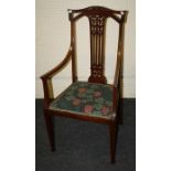 An early 20th century Arts and Crafts style, mahogany open, salon armchair.