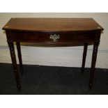 An Edwardian mahogany bow fronted side table with frieze drawer on ring turned supports. 92cm wide
