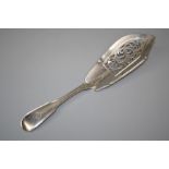 A Victorian silver "fiddle and thread"  fish slice with pierced blade bearing an armorial crest.