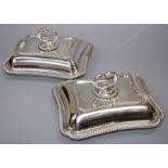 A pair of "Old Sheffield" plated concave, cushion shaped entree dishes and covers woth bayonet fixed
