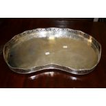 An Edwardian silver on copper, "kidney" shaped two handled gallery tray. 60cm wide