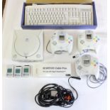 Sega: A collection of assorted Sega Dreamcast items to include: an unboxed console, three unboxed