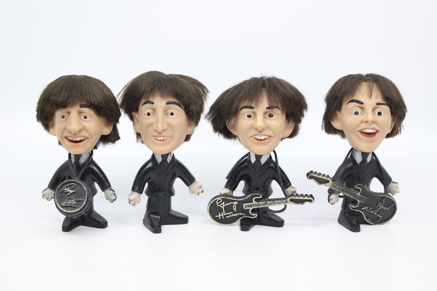 A set of four Beatles figures, by Seltaeb, 1964, including Ringo Starr, John Lennon, George Harrison