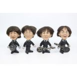 A set of four Beatles figures, by Seltaeb, 1964, including Ringo Starr, John Lennon, George Harrison