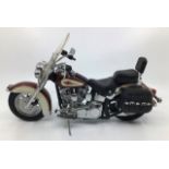 Franklin Mint: A boxed Harley Davidson Heritage Softail by Franklin Mint. Boxed with papers.
