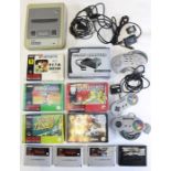 Nintendo: An unboxed Super Nintendo Entertainment System (SNES), together with three controllers,