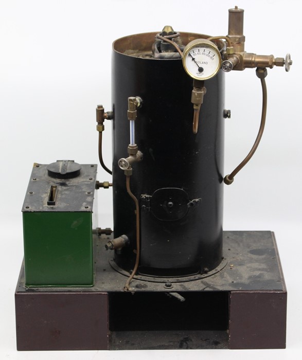 Live Steam: A vertical live steam boiler, scratch-built, upon raised metal base, height approx. 15".