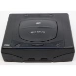 Sega: An unboxed Sega Saturn console, complete with controllers. Untested. Please assess