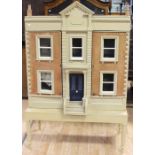 A Victorian style substantial dolls' house complete with furniture and accessories *** Provenance: