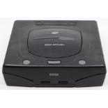 Sega: An unboxed Sega Saturn console, complete with controllers and instructions. Untested. Please