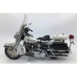 Franklin Mint: A boxed Harley Davidson Electra Glide Police Patrol by Franklin Mint. Boxed with