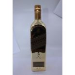 A Johnnie Walker gold label reserve, gold bullion bottle. Limited edition bottle relaunched in