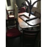 A Regency mahogany twin pedestal dining table, circa 1825, with one additional leaf, reeded sabre