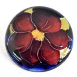 The Mitchell Collection of Moorcroft Pottery: A Moorcroft 'Clematis' pattern brooch on a white metal