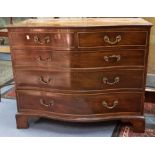 A George III style mahogany serpentine fronted chest of drawers, 20th Century, comprising two