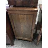 A 19th Century mahogany cupboard with a single panelled door, height 90cm