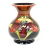 The Mitchell Collection of Moorcroft Pottery: A Moorcroft Flambe 'Orchid' pattern vase on blue/green