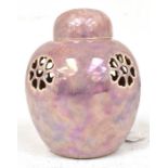 Ruskin Pottery: A Ruskin Pottery lilac lustreware ginger jar and cover with pierced decoration,