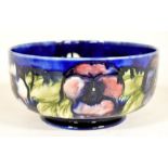 The Mitchell Collection of Moorcroft Pottery: A Moorcroft 'Pansy' pattern bowl on a blue ground.