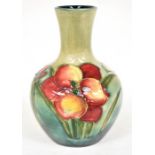 The Mitchell Collection of Moorcroft Pottery: A Moorcroft 'Freesia' pattern vase on blue/green