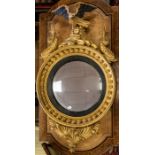 A 19th Century gilt framed convex wall looking glass, eagle and dolphin finial, ball bezel ,acanthus