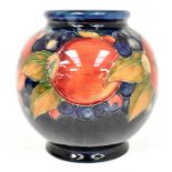 The Mitchell Collection of Moorcroft Pottery: A Moorcroft 'Pomegranate' pattern vase on blue/ochre