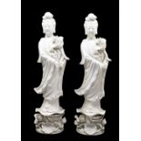 A pair of Chinese 'blanc-de-chine' figures of Guanyin, 20th Century, modelled standing and holding a