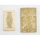 A 19th Century Chinese profusely carved ivory calling card case, one side depicting Gentleman