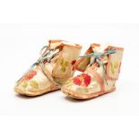 A pair of Georgian Century silk embroidered booties, worked with flowers and foliage on a cream