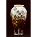 A Moorcroft 'Bramble' pattern baluster vase designed by Sally Tuffin. Height approx 26cm.
