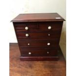 A late Victorian mahogany miniature chest of drawers, circa 1890, two short over three long