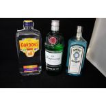 A selection of gins to include Bombay sapphire, gordons imported gin and torquay gin. (3)