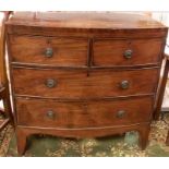 **WITHDRAWN** A George III mahogany bow front chest of drawers, two short over two long cockbeaded