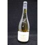 A Bottle Of Domaine Laroche Chablis Premier Cru 1995. A White wine known for its green and flinty
