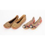 Two pairs of hand embroidered children's Oriental shoes, one pair is a gold embellished slip on