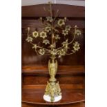 A pair of 19th century brass ecclesiastical alter five-branch ten-light candleabra, profusely