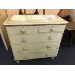 A Victorian painted pine chest of drawers, two short over three long drawers with turned pulls,
