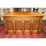 A Victorian style pitch pine Gothic Revival alter table, inscribed to frieze, 'This Do In