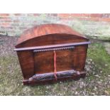 A mid Victorian flame mahogany cellarette, circa 1860, arched hinged cover, lead lined fitted