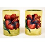 The Mitchell Collection of Moorcroft Pottery: 2 Moorcroft 'Hibiscus' pattern spill jars on yellow /