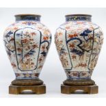 A pair of Japanese Imari ormolu-mounted  ovoid vases, late 17th century, each sprig-moulded and