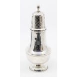A George V large silver caster, plain baluster body, the domed cover with pieced decoration wyvern