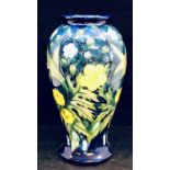 A Moorcroft 'Buttercup' pattern baluster vase designed by Sally Tuffin. Height approx 25cm.