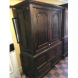 A George III oak linen press, circa 1770, plain cornice, twin panelled doors opening to a hanging